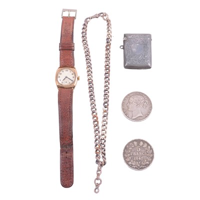 Lot 447 - A 9 carat gold wristwatch, silver vesta case, two silver coins, and an Albert watch chain.