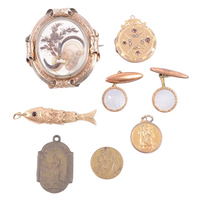 Lot 187 - A Victorian mourning brooch, locket, articulated fish, St Christopher and metal cufflinks.