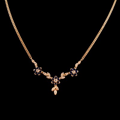 Lot 264 - A sapphire and diamond floral design necklace, and a loose sapphire stone.