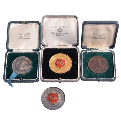 Lot 143 - One 9 carat gold, two silver and one bronze bakers' medals.