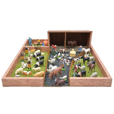 Lot 339 - A collection of resin farmyard animals and accessories, with wooden farmyard playset