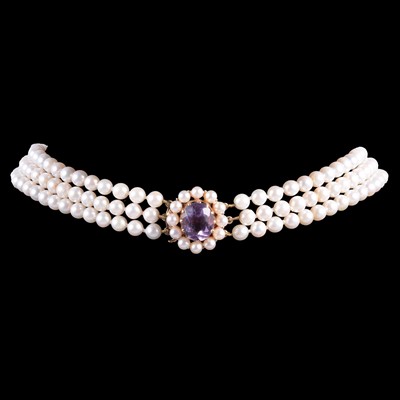 Lot 298 - A three row cultured pearl choker with amethyst cluster clasp.