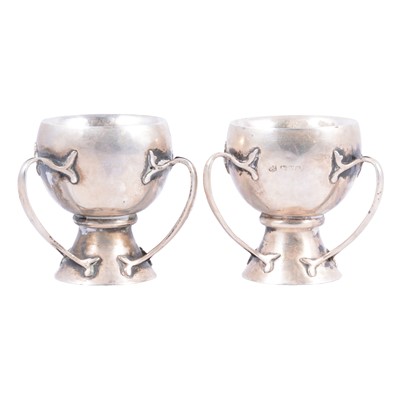 Lot 274 - A pair of small silver cups in an Art Nouveau design.