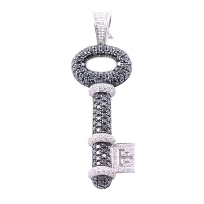 Lot 257 - Theo Fennell - a diamond set key pendant.