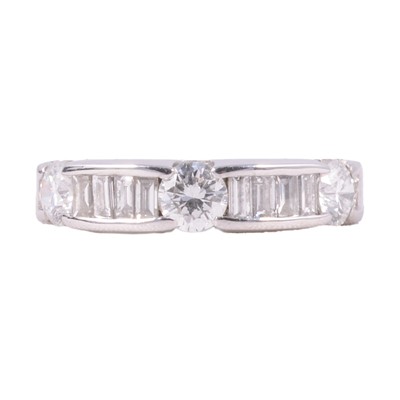 Lot 74 - A diamond half eternity eternity ring.