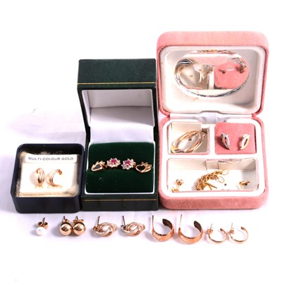 Lot 229 - Twelve pairs of gold / yellow metal earrings for pierced ears, some gemset