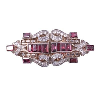 Lot 467 - An Art Deco garnet and synthetic white sapphire duette dress clip.