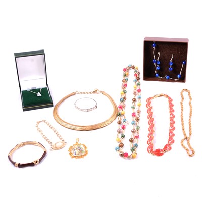 Lot 488 - A collection of vintage costume jewellery pendants, chains, bangles and bracelets.