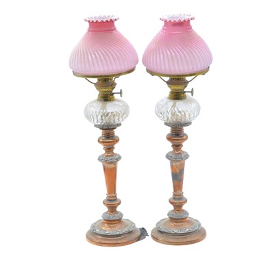 Lot 72 - Pair of electroplated candlesticks, with peg lamp fitments