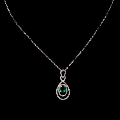 Lot 266 - An emerald and diamond pendant and chain.