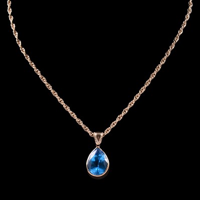 Lot 282 - A heat treated blue topaz pendant and chain.