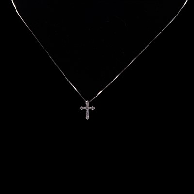 Lot 263 - A diamond set cross and chain.