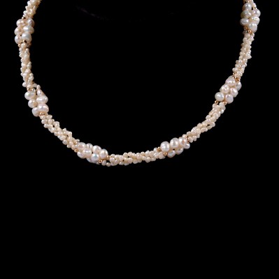 Lot 314 - A freshwater pearl necklace with 585 fastener.