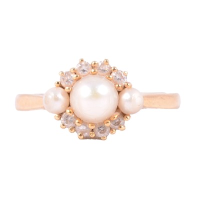 Lot 22 - A pearl and diamond ring.