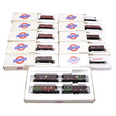 Lot 295 - Eleven Liliput HO gauge freight cars and coaches, boxed