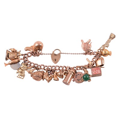 Lot 202 - A 9 carat rose gold charm bracelet with charms.