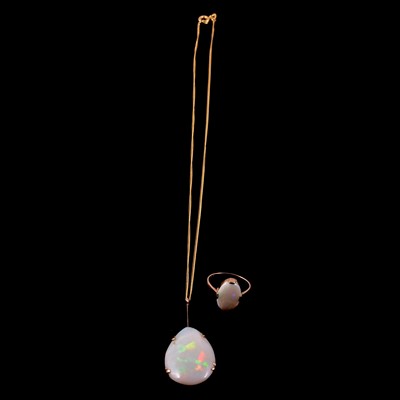 Lot 279 - An opal dress ring and an opal pendant on a chain.