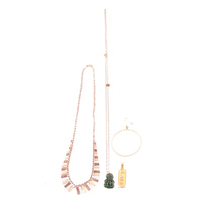 Lot 145 - A 9 carat tricolour gold fringe necklace, Egyptian pendant, gold earring, Maori charm and chain.