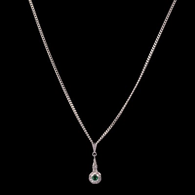 Lot 267 - An emerald and diamond pendant and chain.