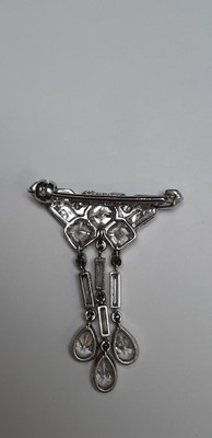 Lot 166 - Tiffany & Co. - a signed diamond set brooch.