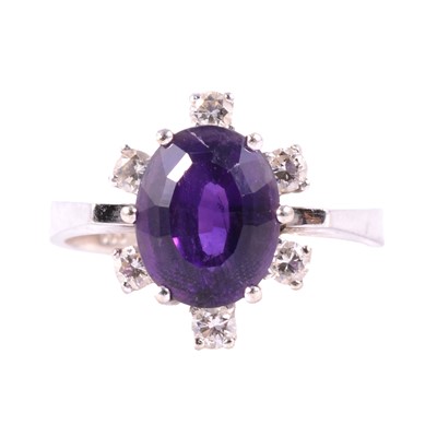 Lot 26 - An amethyst and diamond dress ring.