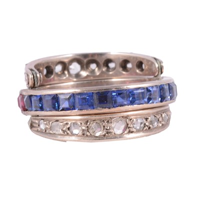 Lot 15 - A sapphire, ruby, and diamond night and day ring.