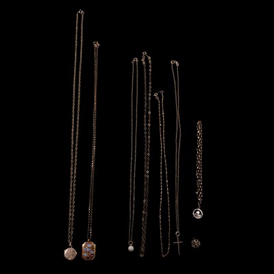 Lot 248 - A collection of gold pendants and chains, lockets, cross, bracelet and charms.