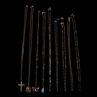 Lot 249 - A collection of gold pendants and chains, butterfly, St Christopher, cross.