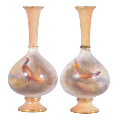 Lot 83 - A pair of Royal Worcester bottle vases