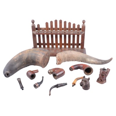 Lot 99 - Carved wooden pipes, other pipes, pipe stand and horns.