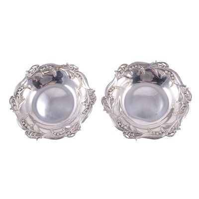 Lot 236 - Tiffany & Co - a pair of Sterling Silver lily of the valley dishes.