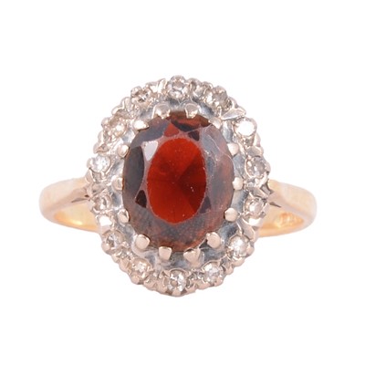 Lot 43 - A garnet and diamond cluster ring.