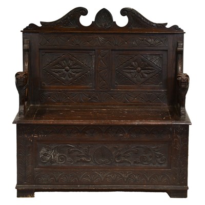 Lot 384 - Late Victorian carved oak monks bench