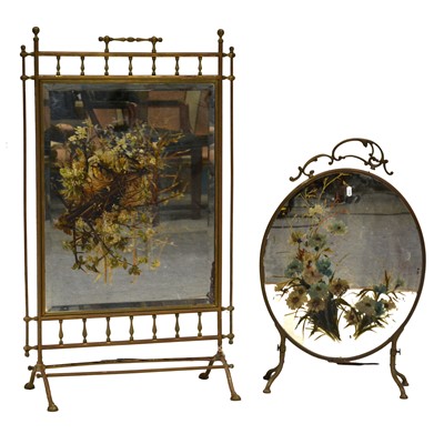 Lot 426 - Two brass framed painted mirror fire screens