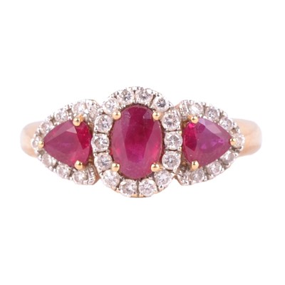 Lot 34 - A ruby and diamond cluster ring.