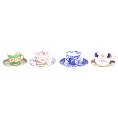 Lot 58 - A collection of mostly English bone china tea cups, saucers and trios