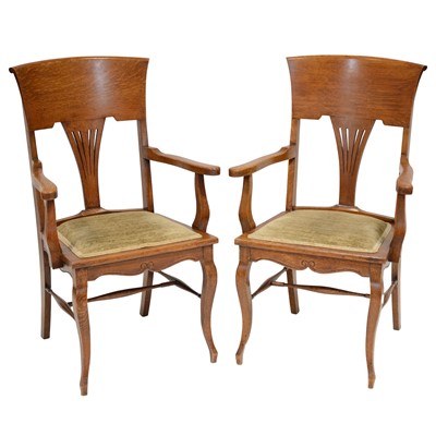 Lot 404 - Pair of Arts and Crafts style oak armchairs