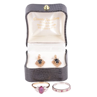 Lot 36 - Two ruby and diamond rings, and a pair of sapphire earrings.