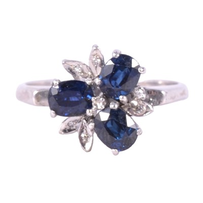 Lot 27 - A sapphire and diamond ring.