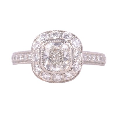 Lot 18 - A diamond halo ring.