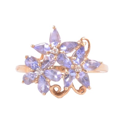 Lot 42 - A tanzanite and diamond cluster ring.