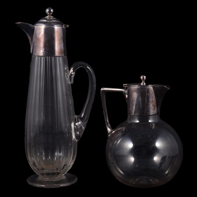 Lot 28 - Two Edwardian glass claret jugs with silver plated mounts