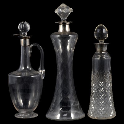 Lot 30 - Silver mounted claret jug and two silver mounted decanters