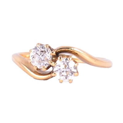 Lot 8 - A diamond two stone crossover ring.