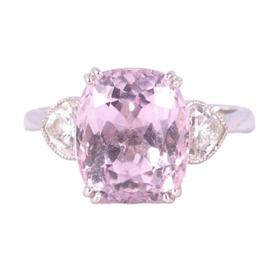 Lot 39 - A diamond and pink kunzite three stone ring.