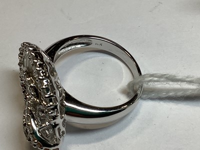 Lot 96 - A diamond loop ring.