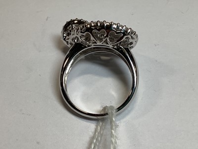 Lot 96 - A diamond loop ring.