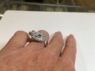 Lot 96 - A diamond loop ring.