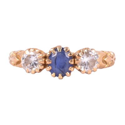 Lot 29 - A sapphire and diamond ring.