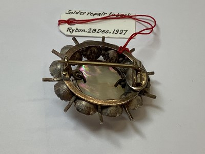 Lot 331 - A graduated paste riviere necklace, large Eisenberg dress clip, Man In The Moon brooch.